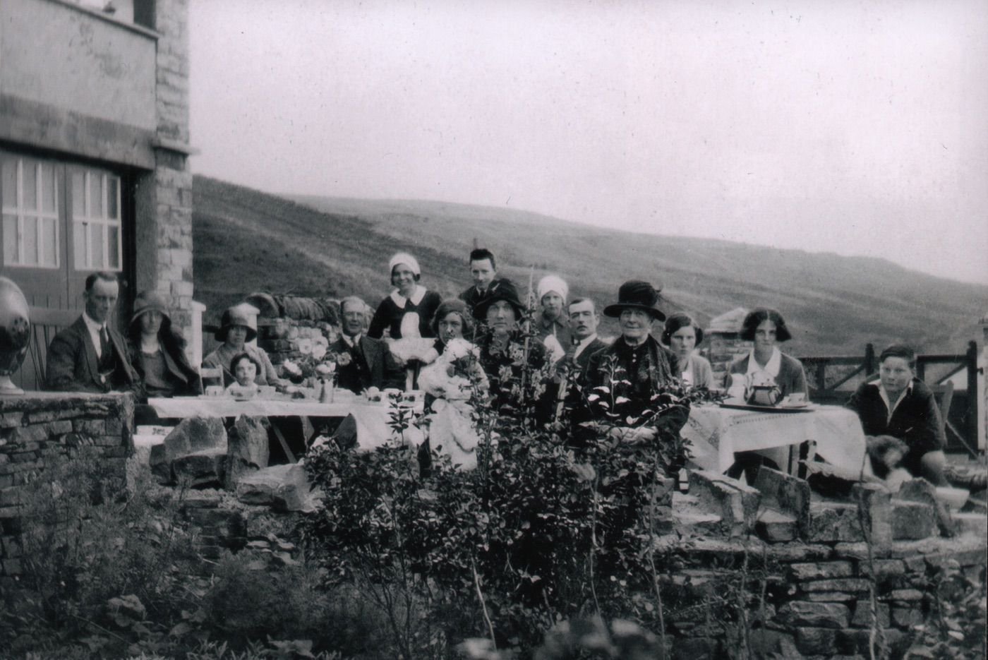 Coll. AMHS. copy print labelled verso: Copyright �Keith Pritchard. Impossible. The image is clearly over 70 years old and is �-free.An alfresco meal in the ca 1930s at High Hundy Bridge, above Garrigill.ea party at HundyBridge, Garrigill, 1931. The Adamson family. Fred at far R. They owned Crops Hall & Gatefoot farms - & later added Low Shield Hill.